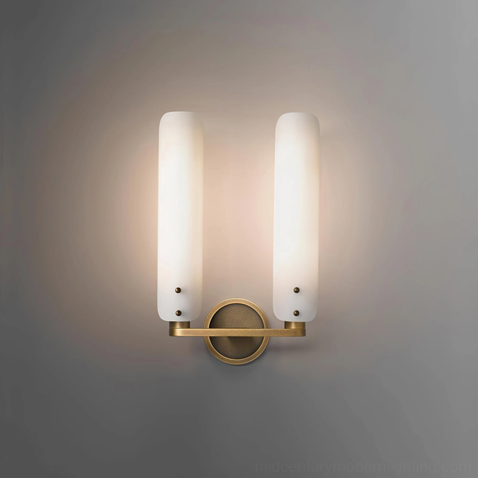 Lit Norwalk wall sconce with warm ambient glow, minimalist luxury modern interior accent lighting