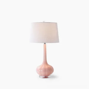Notte ceramic glass table lamp with pink base and white fabric shade on minimalist white background