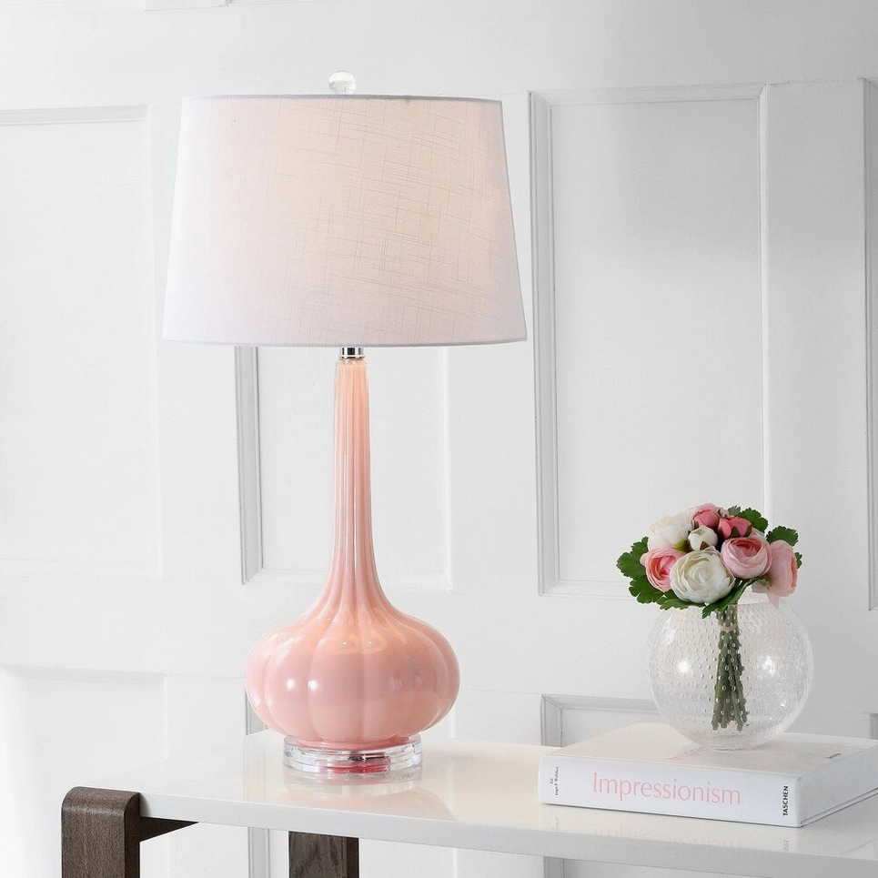 Pink gourd-shaped ceramic glass table lamp displayed on home console table with minimalist glam decor