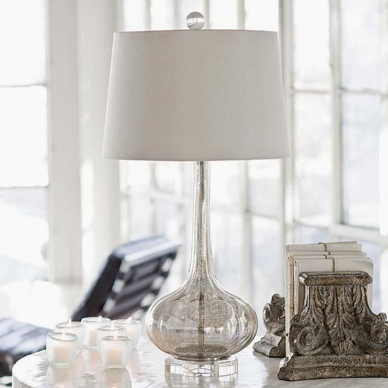 Smoke grey ceramic glass table lamp with fabric shade on sunlit accent table minimalist luxury style