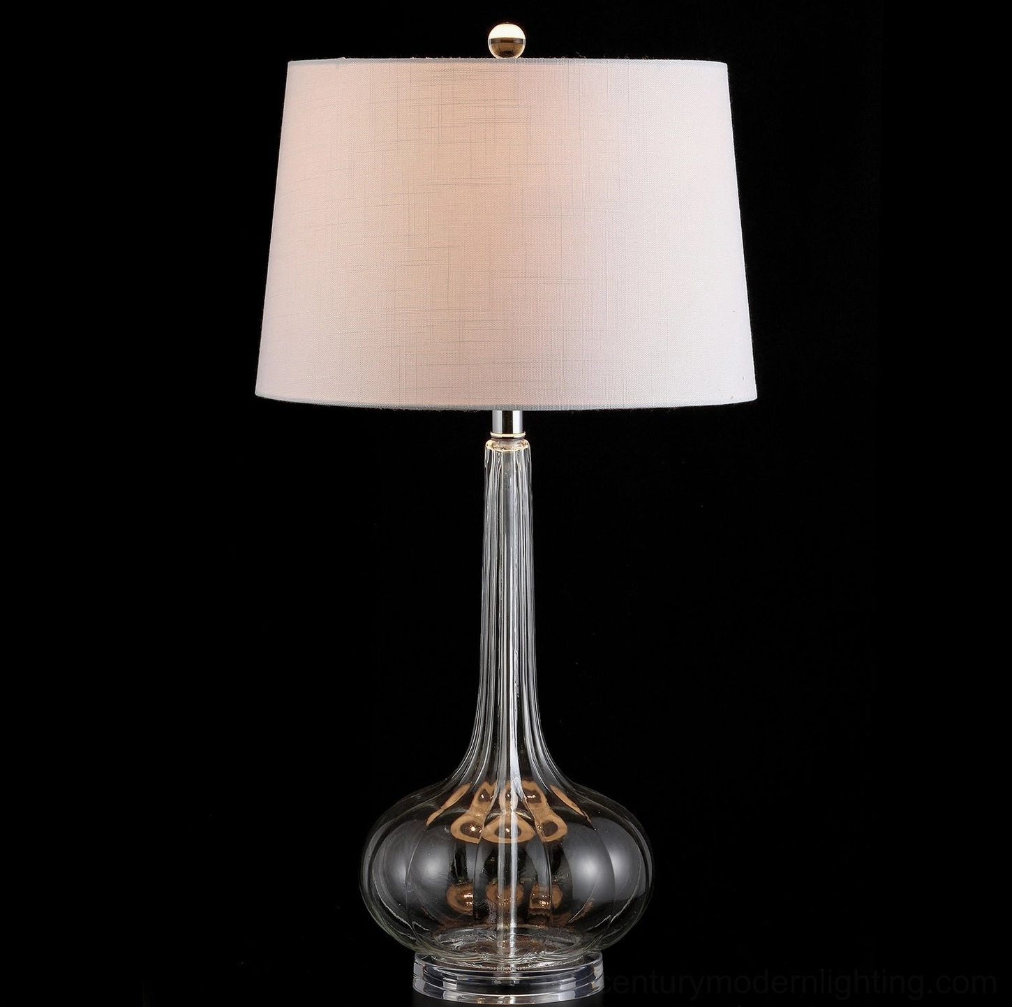 Smokey clear ceramic glass table lamp with gilded interior glass detail studio shot black background