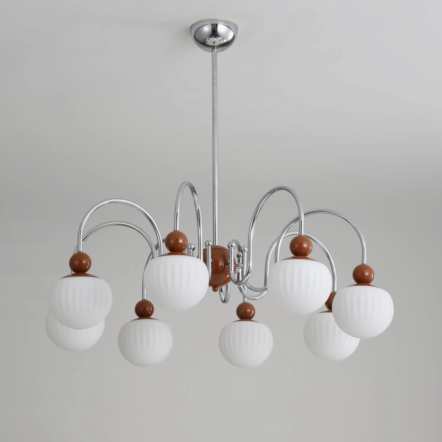 Close-up of Notti chandelier showing precise craftsmanship of metal joints and frosted glass shade mounting