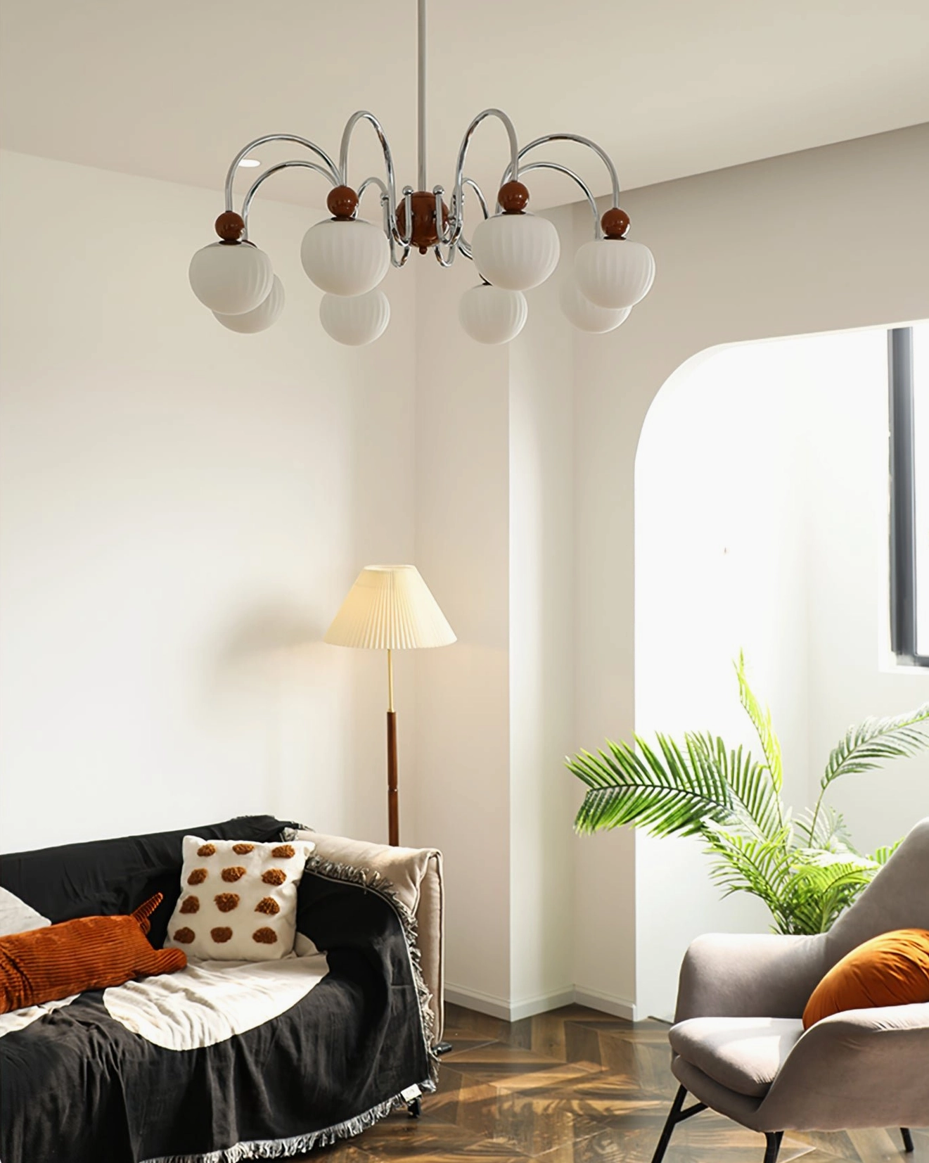 Notti 8-arm chandelier installed in dining area creating warm inviting focal point above table