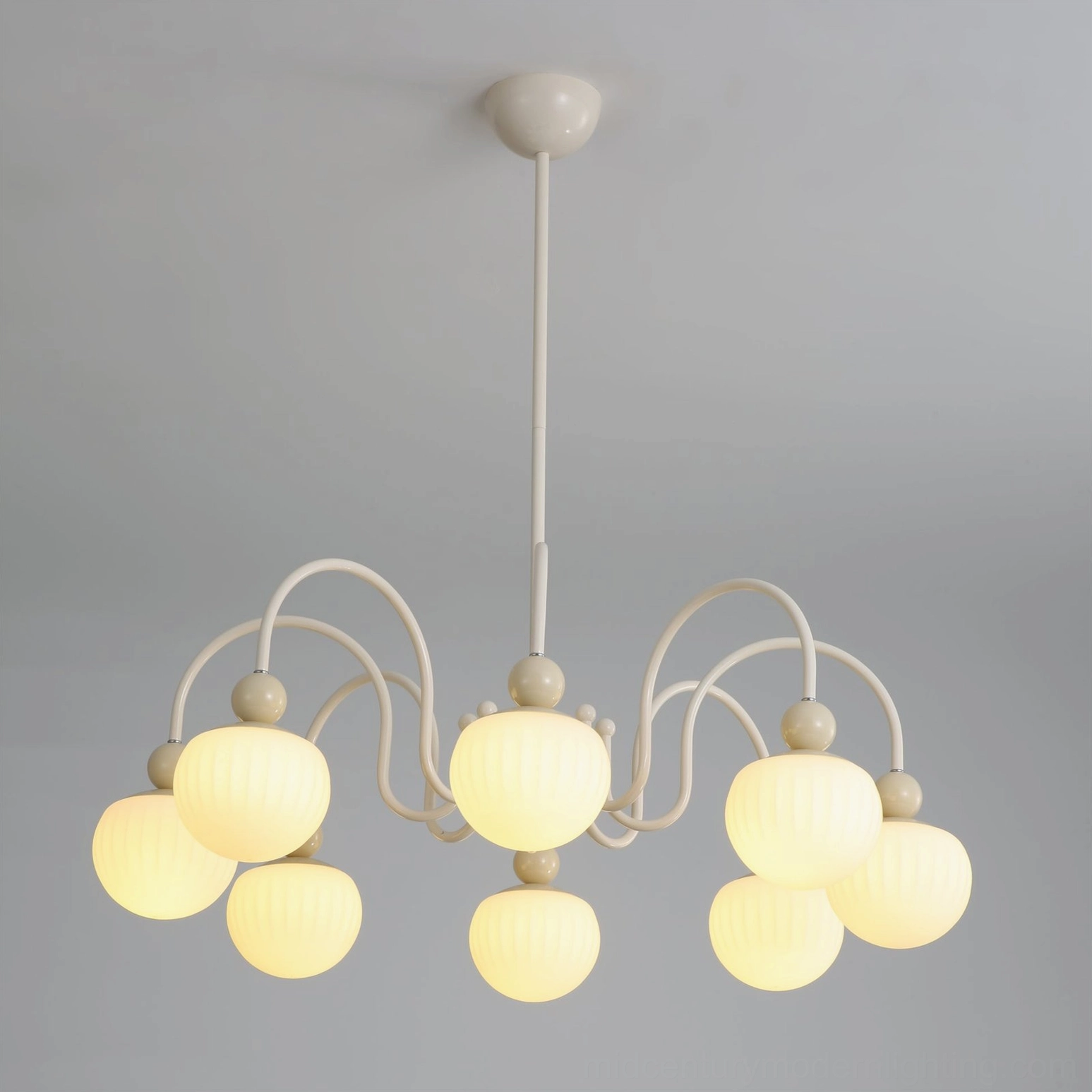 Notti chandelier in entryway setting creating elegant first impression with refined charm and sophistication