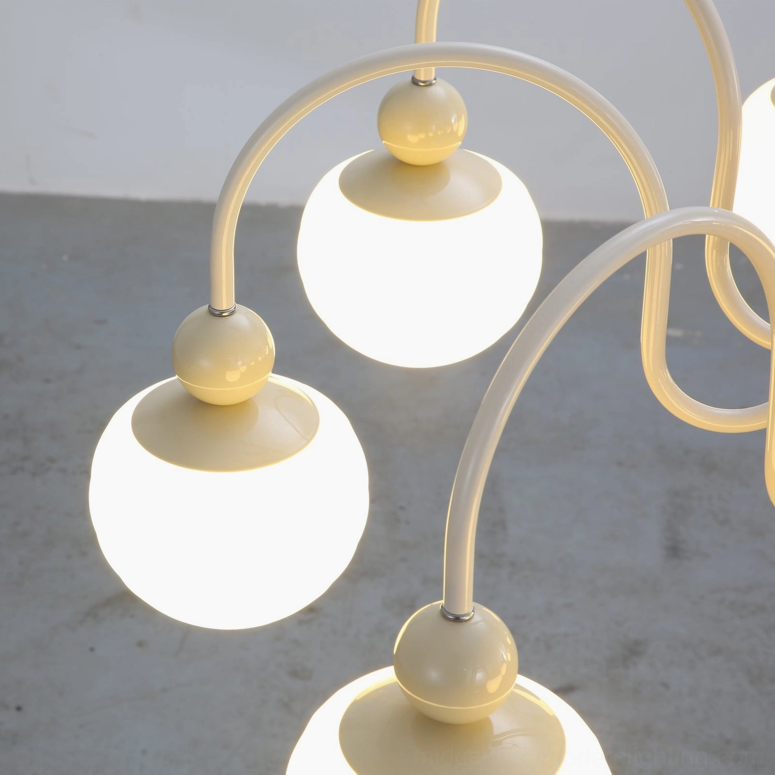 Notti mid-century modern 8-head chandelier detail showing frosted glass globe light diffusion warmth