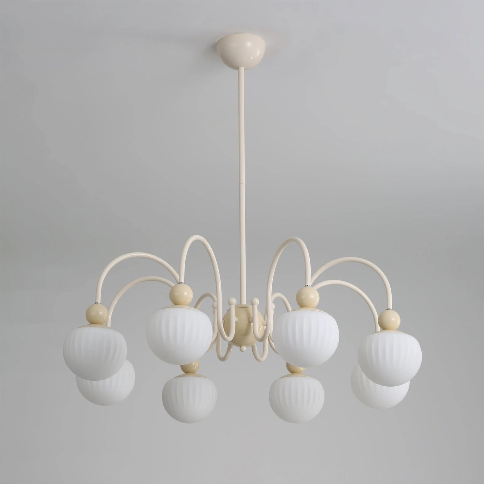 Unlit Notti 8-head chandelier frontal view with ribbed matte white glass globes and cream metal arms