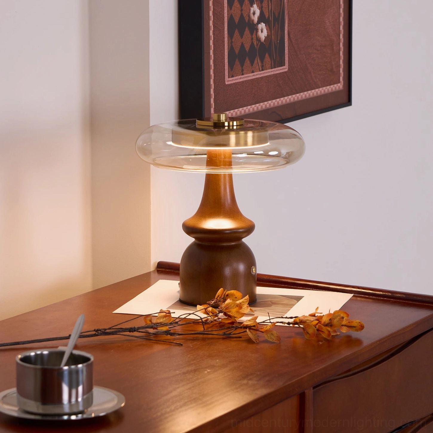 Nova table lamp detail shot showing translucent glass dome shade light diffusion pattern and brass top hardware assembly
