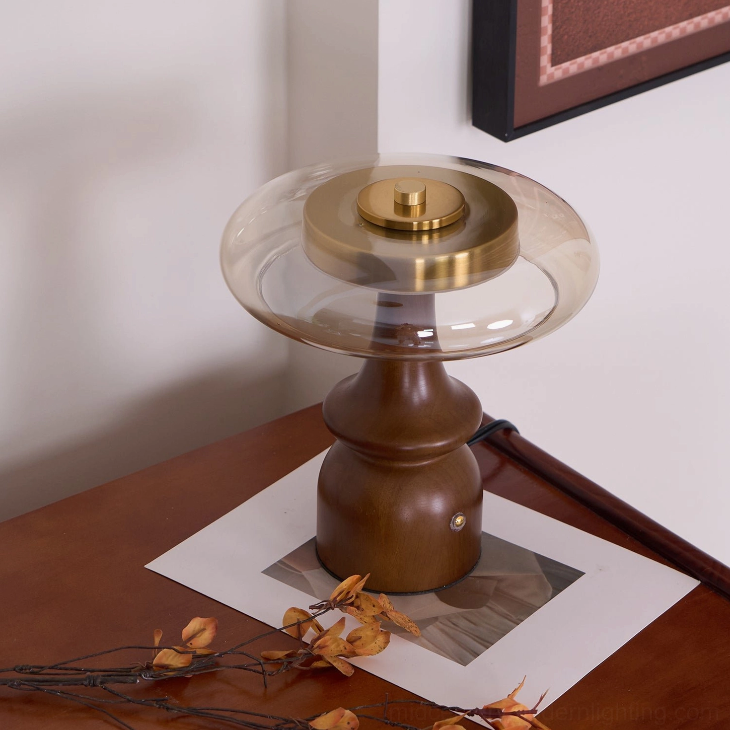Nova mid-century table lamp rear three-quarter view with brass hardware visible, positioned on vintage side table with geometric wall art