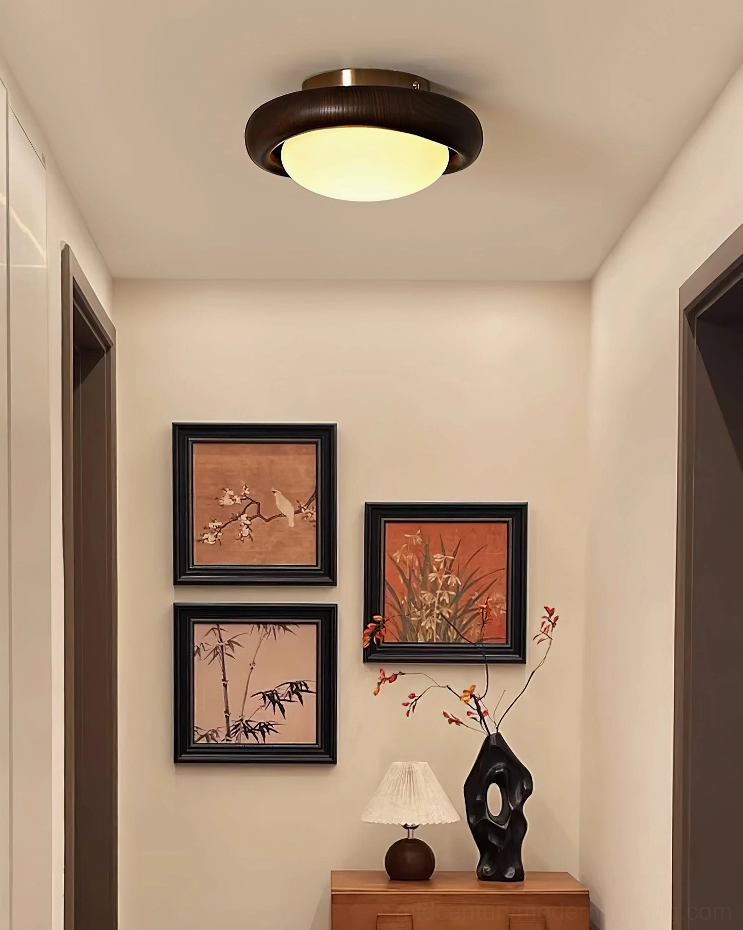 Novi modern ceiling lamp in residential entryway with wall art and console table decor
