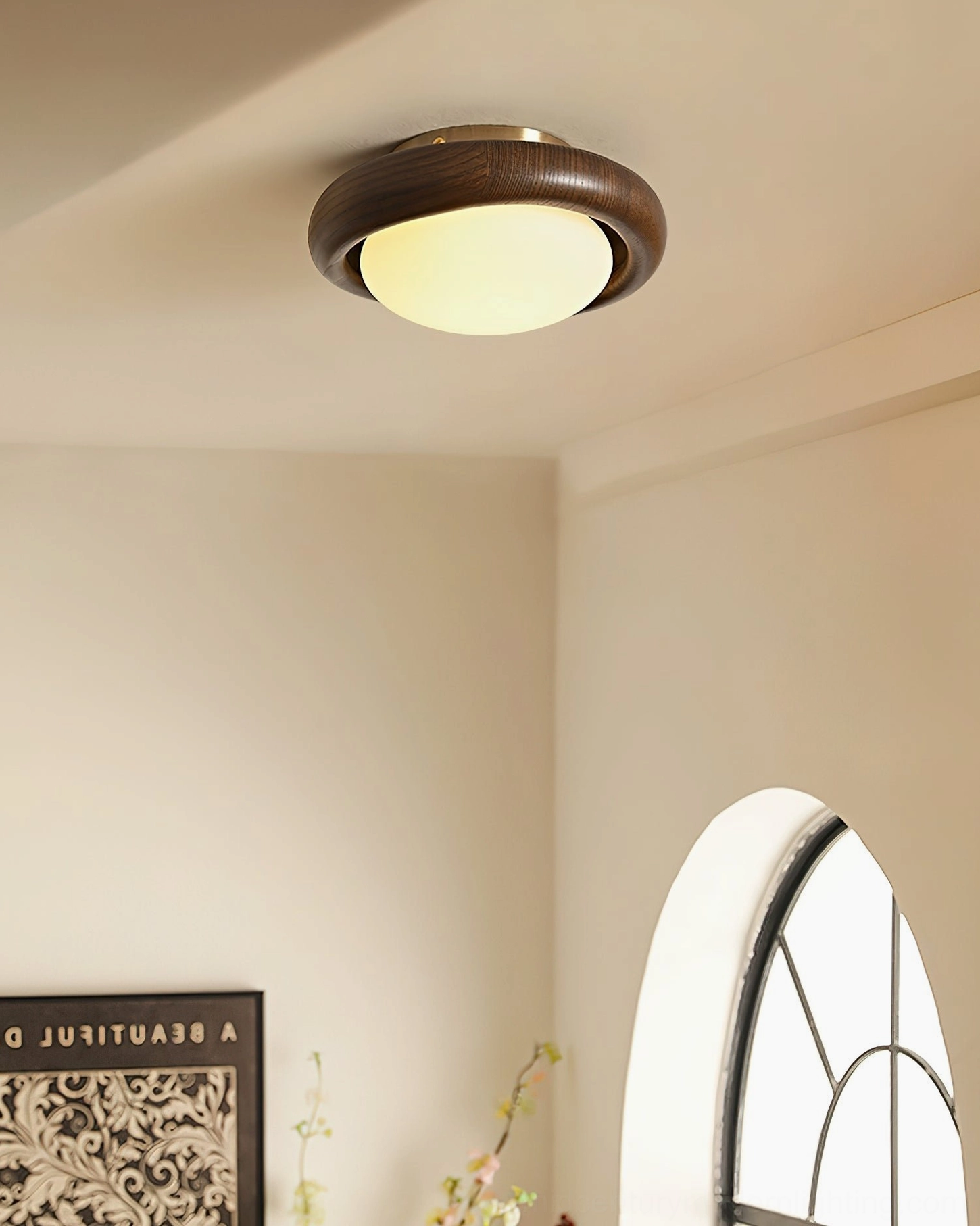 Novi flush mount light in hallway with arched window providing soft warm illumination