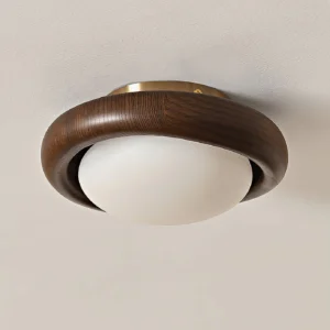 Novi flush mount ceiling lamp installed overhead showing warm LED glow and natural wood grain detail