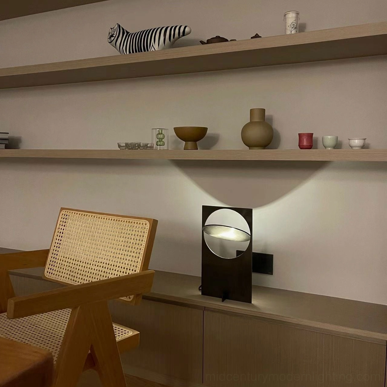 OBJ 01 matte black table lamp full product shot, geometric form with integrated LED, studio lighting showcasing metal finish texture