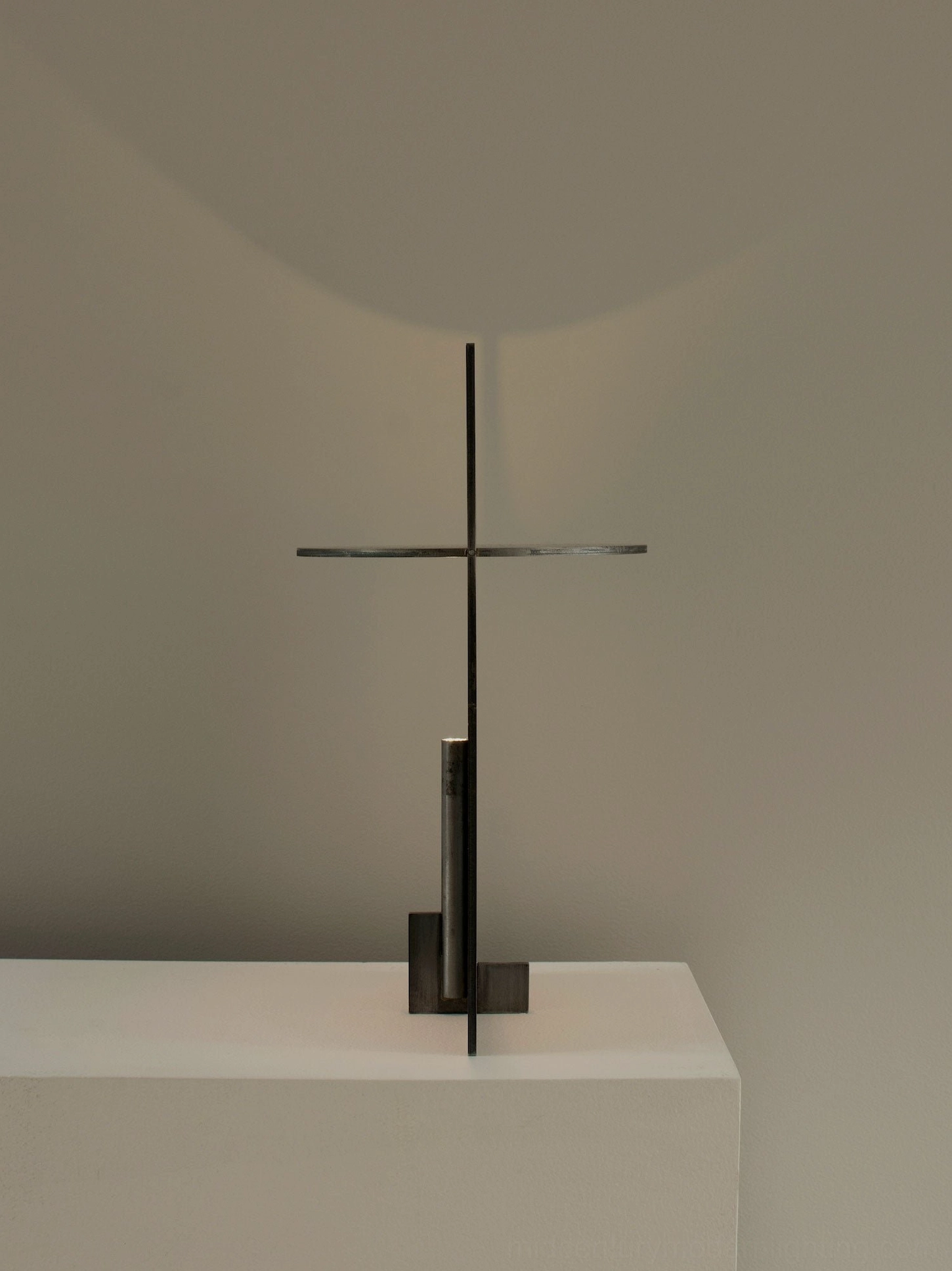OBJ 01 brass gold table lamp sculptural minimalist view, warm ambient light emission, metal craftsmanship quality, design gallery aesthetic
