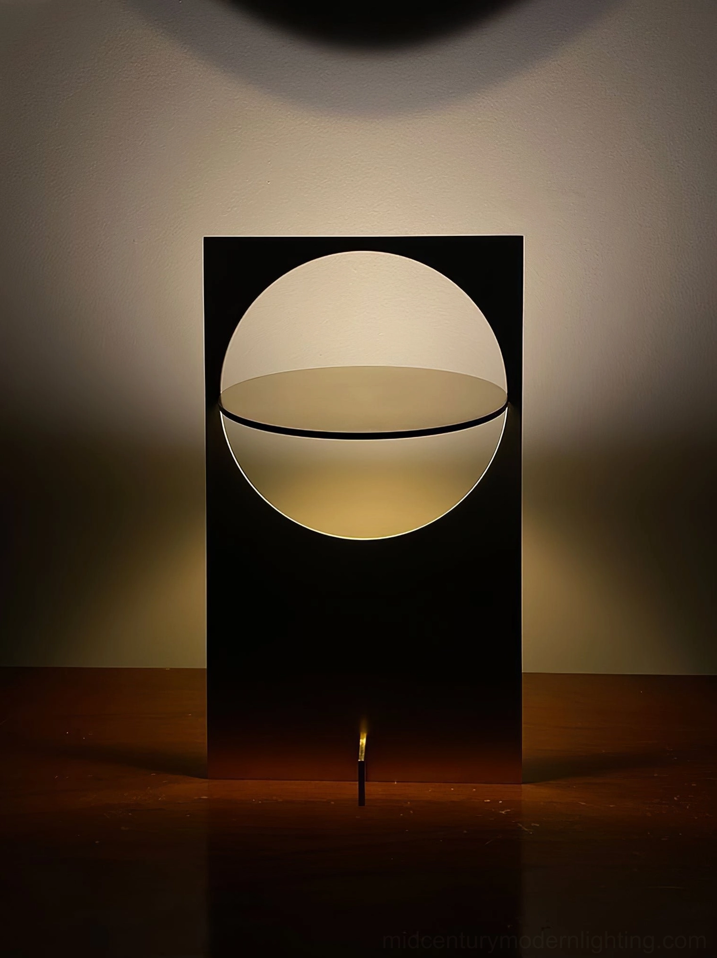 OBJ 01 brushed copper table lamp illuminated, warm metallic glow, mid-century modern aesthetic, architectural lighting design showcase