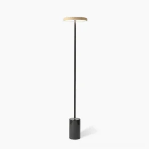 Oblique modern floor lamp with minimalist black metal pole and marble base, studio shot on white background showing the lamp's elegant geometric silhouette