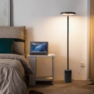 Three-color LED floor lamp in bedroom interior, warm light setting creating ambient glow beside bedside, Scandinavian modern lighting