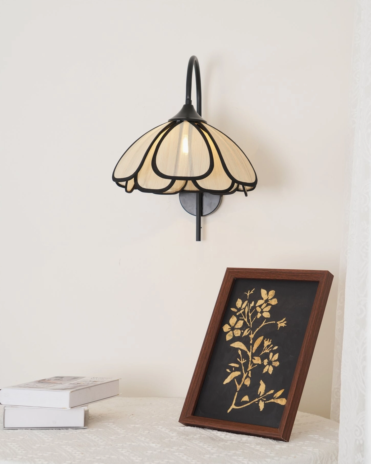 Compact Okai floral wall lamp overhead view with side table styling and home decor