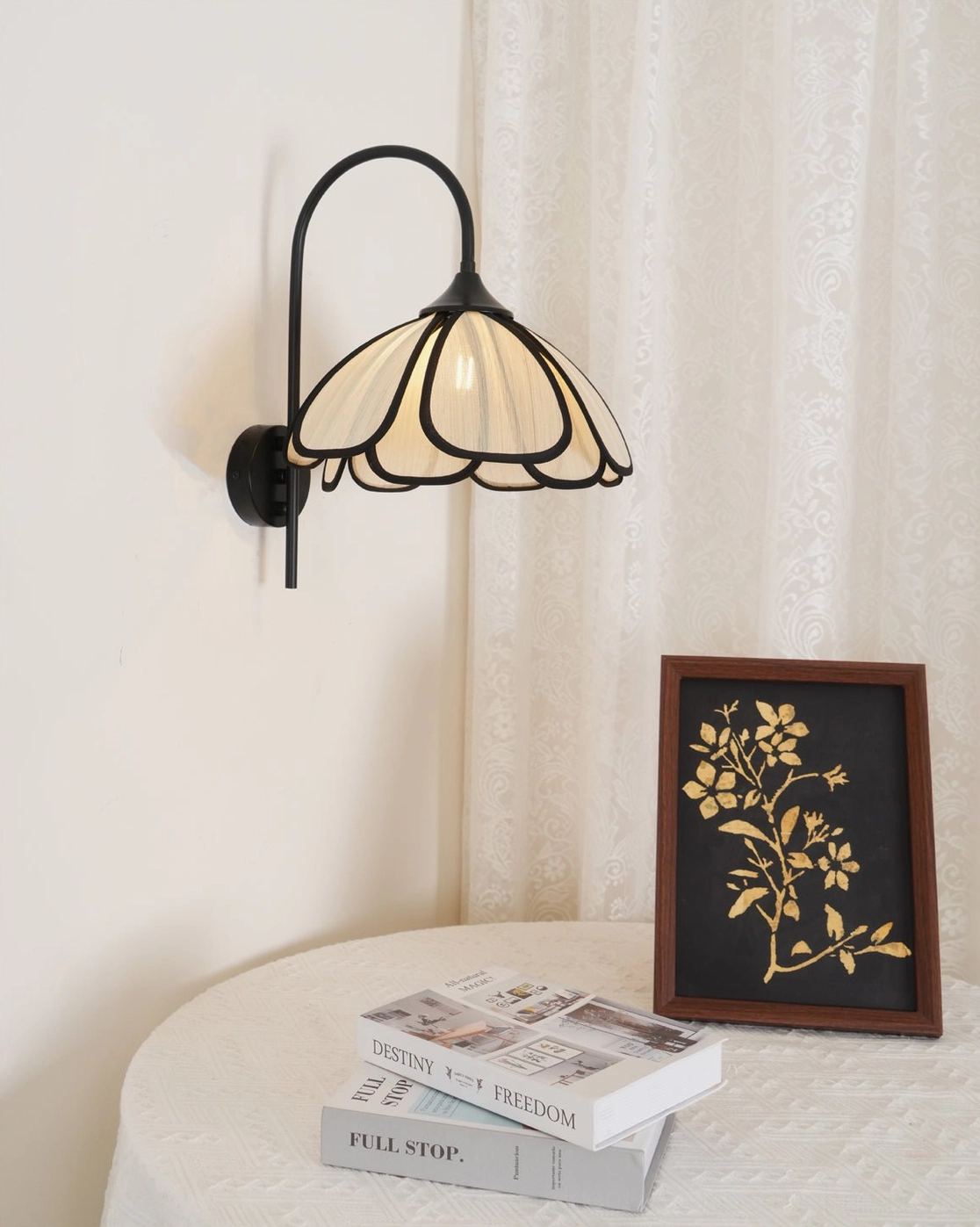Okai wall sconce in dressing table setting with neutral home decor accessories