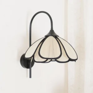 Mid-century modern wall sconce with curved gooseneck arm and fabric petal shade detail