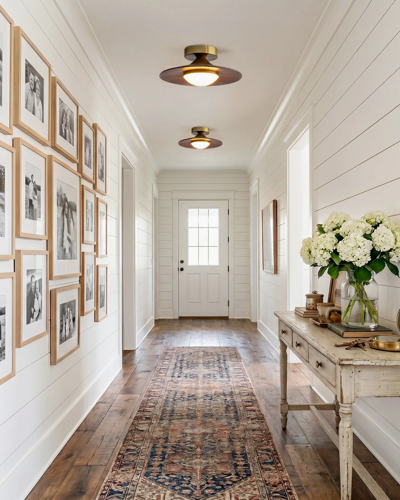 Pair of Olav mid-century modern ceiling lights farmhouse style hallway with shiplap walls and photo gallery