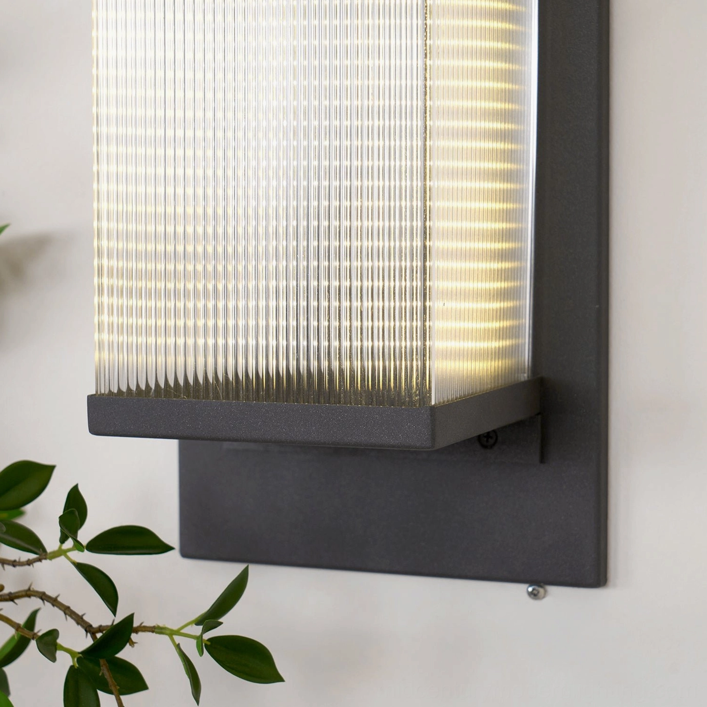 Oleron Box outdoor wall lamp architectural detail, mounting and construction visible, professional IP65 rated fixture, modern design element