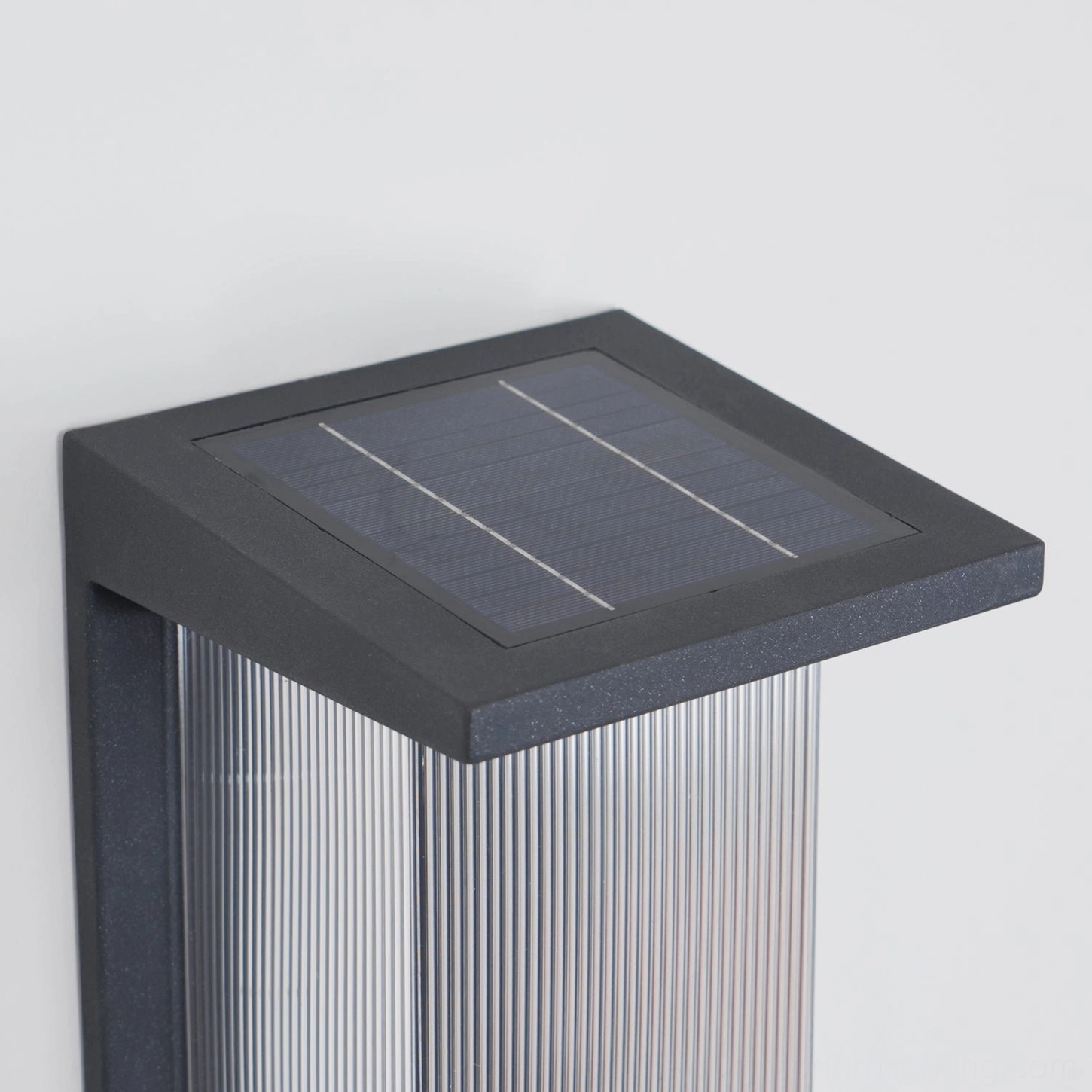 Oleron Box solar-powered wall lamp, sustainable outdoor lighting, warm ambient glow, architectural minimalist design, energy-efficient