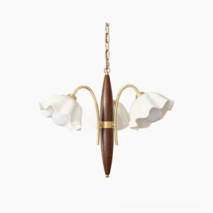 Olina flower ceramic chandelier with four light heads, ruffled white ceramic shades, brass gold accents and dark wood rod frame - overhead studio view