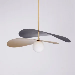 Close-up detail of Olivia pendant light frosted white glass globe bulb beneath brass suspension rod
