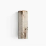 Ondas alabaster wall sconce with fluted wave design, front view showing creamy white stone and natural brown veining against studio background