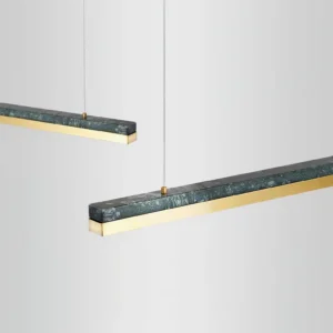 Two One Word pendant lights suspended side by side, showcasing dark green marble detail and brass metal accents
