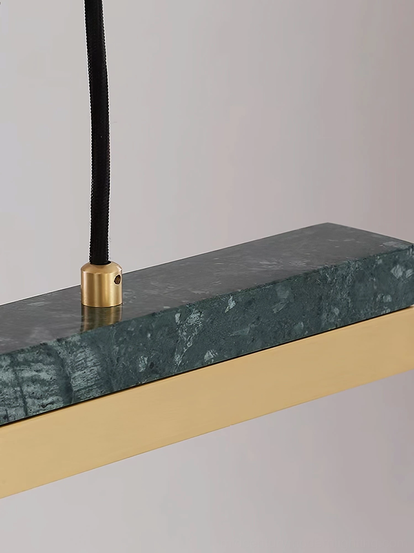 Indian green marble surface texture of One Word pendant light with brass edge trim, material detail