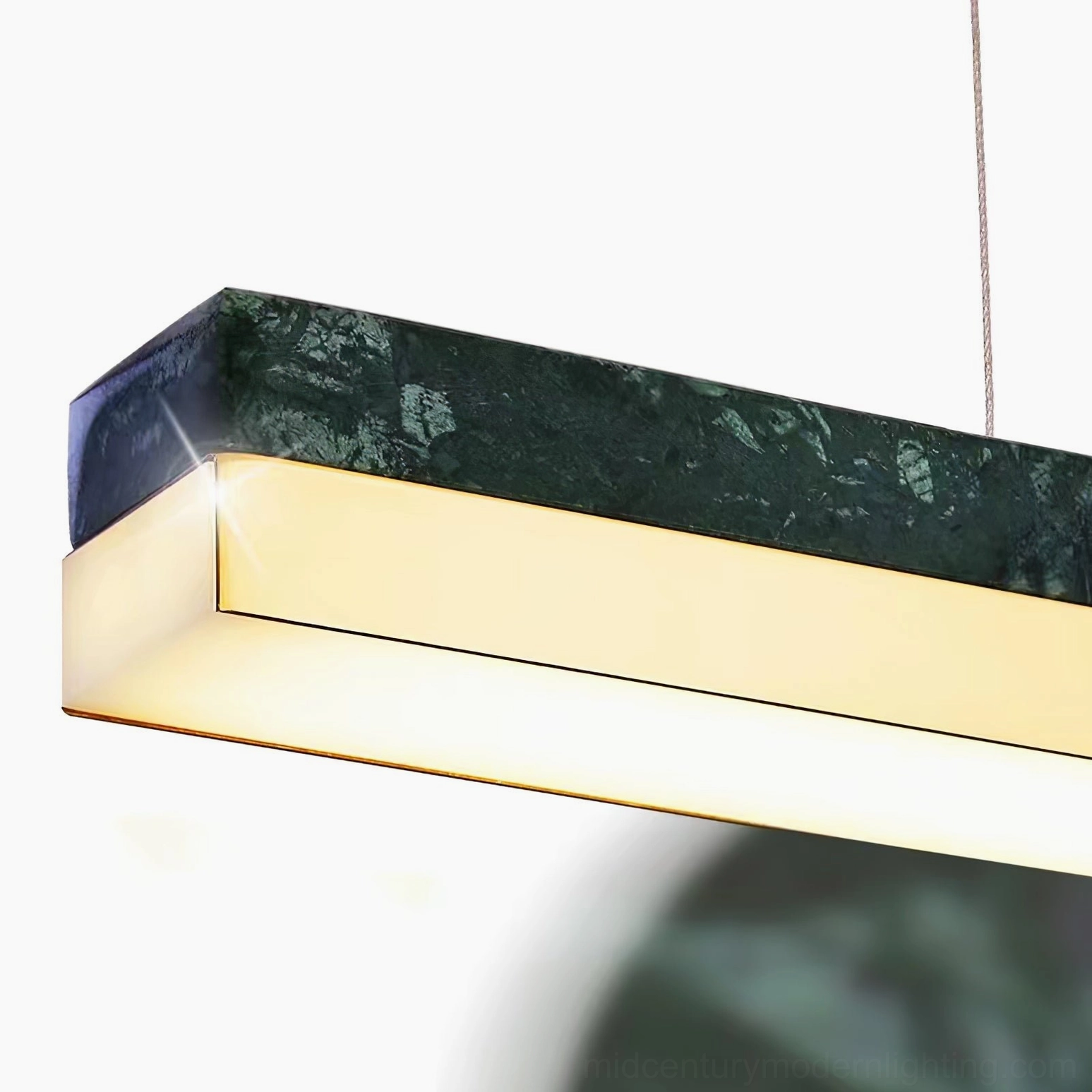 One Word linear pendant fixture showing wire suspension length and height adjustment capability