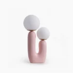 Oo textured ceramic table lamp with dual frosted glass shades, studio front view