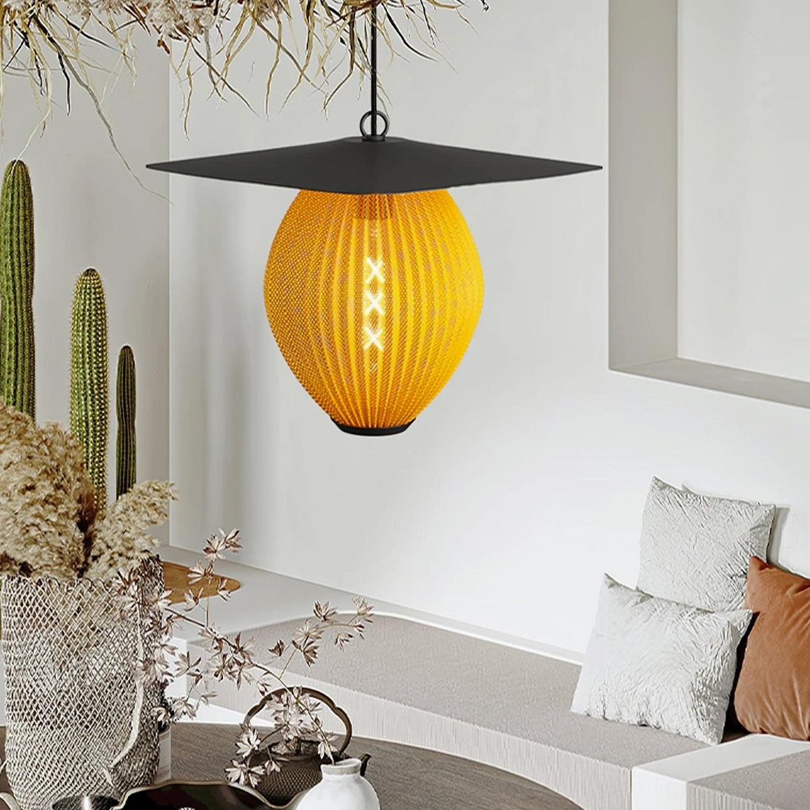 Orange-yellow Satellite pendant light with visible LED filament in modern living room