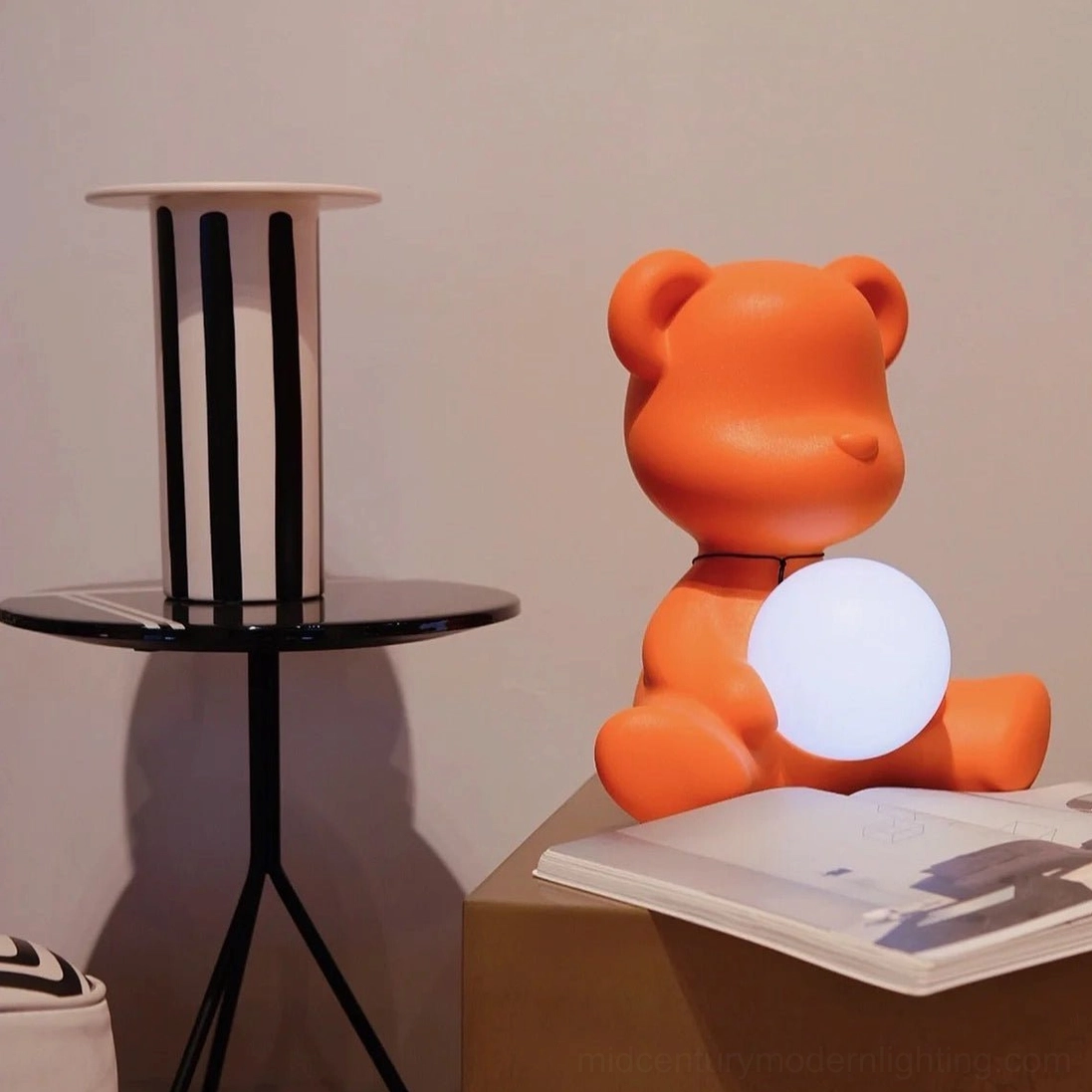 Orange teddy table lamp unlit on home office desk with contemporary minimalist styling