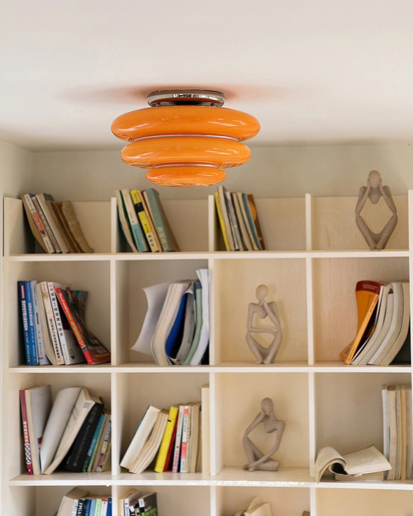 Tiered orange ceiling light chrome base display shelves home study