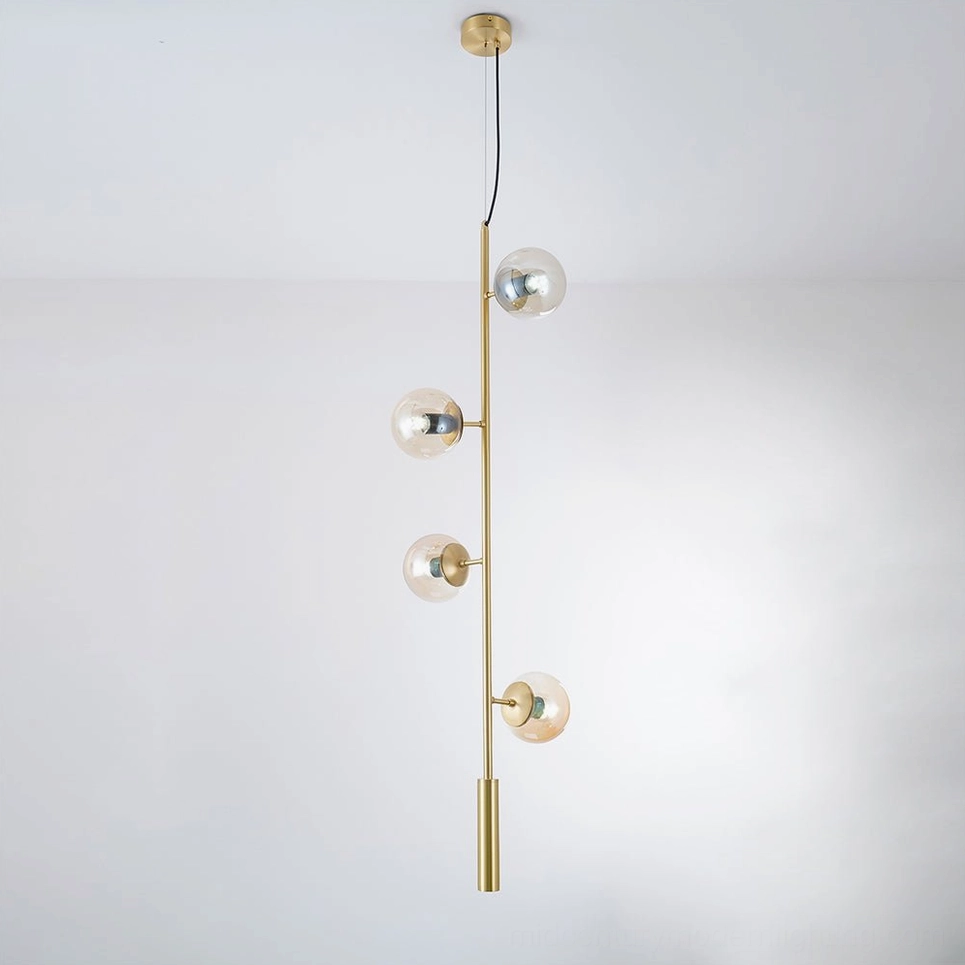 Orb pendant light with amber glass shade and black metal frame, interior installation