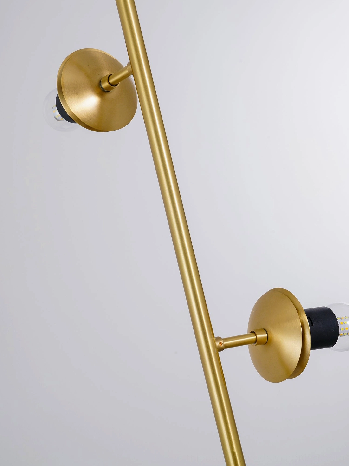 Orb pendant light rod and dual brass lamp mount hardware close-up on white background
