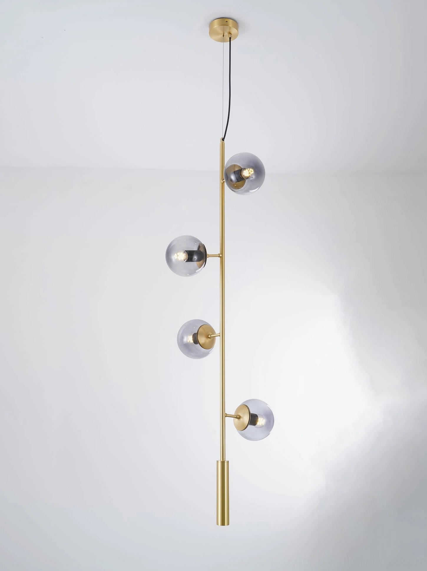 Orb pendant light fixture showing brass rod and adjustable suspension system