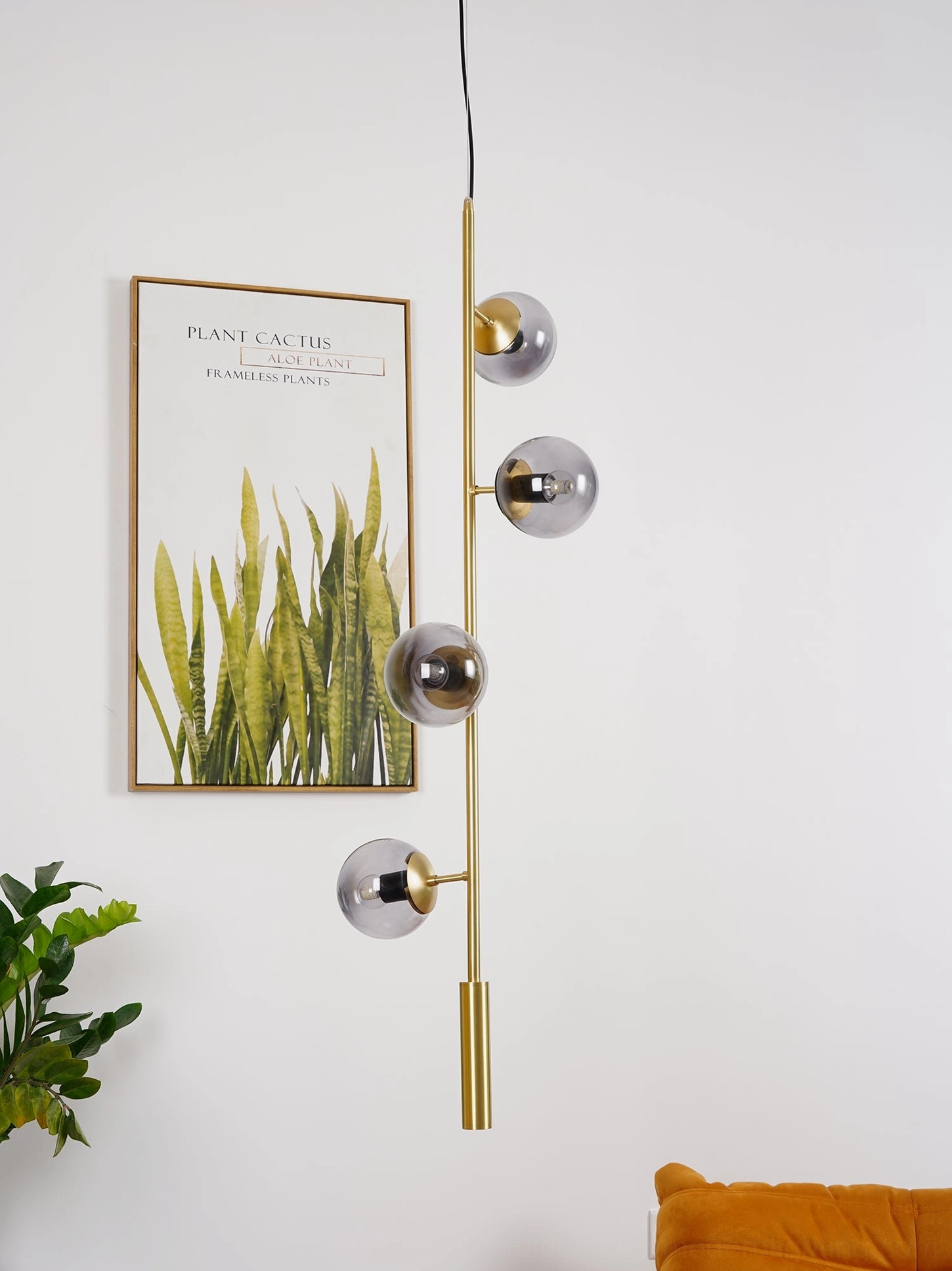 Orb pendant light with clear borosilicate glass and refined brass suspension wire