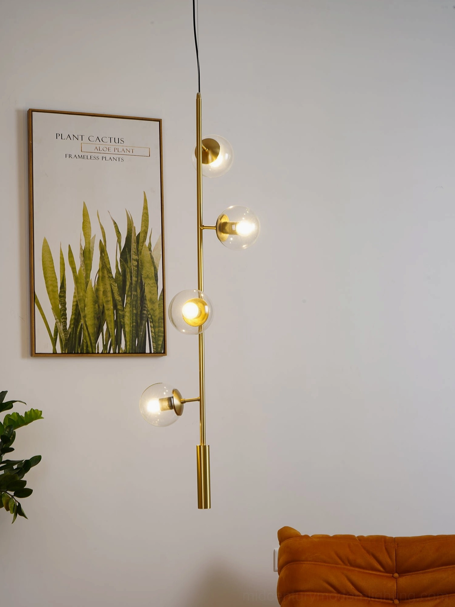Single orb pendant light with frosted glass globe against neutral wall background