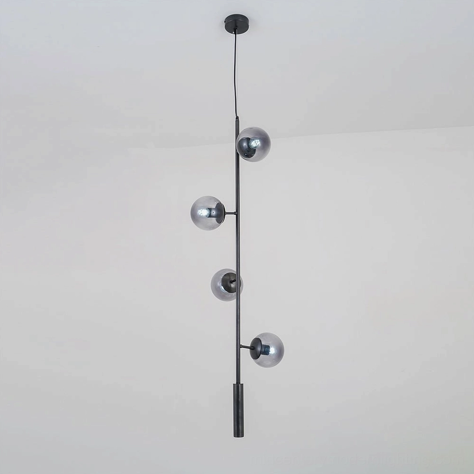 Smoke grey orb pendant light with black metal rod in contemporary interior setting