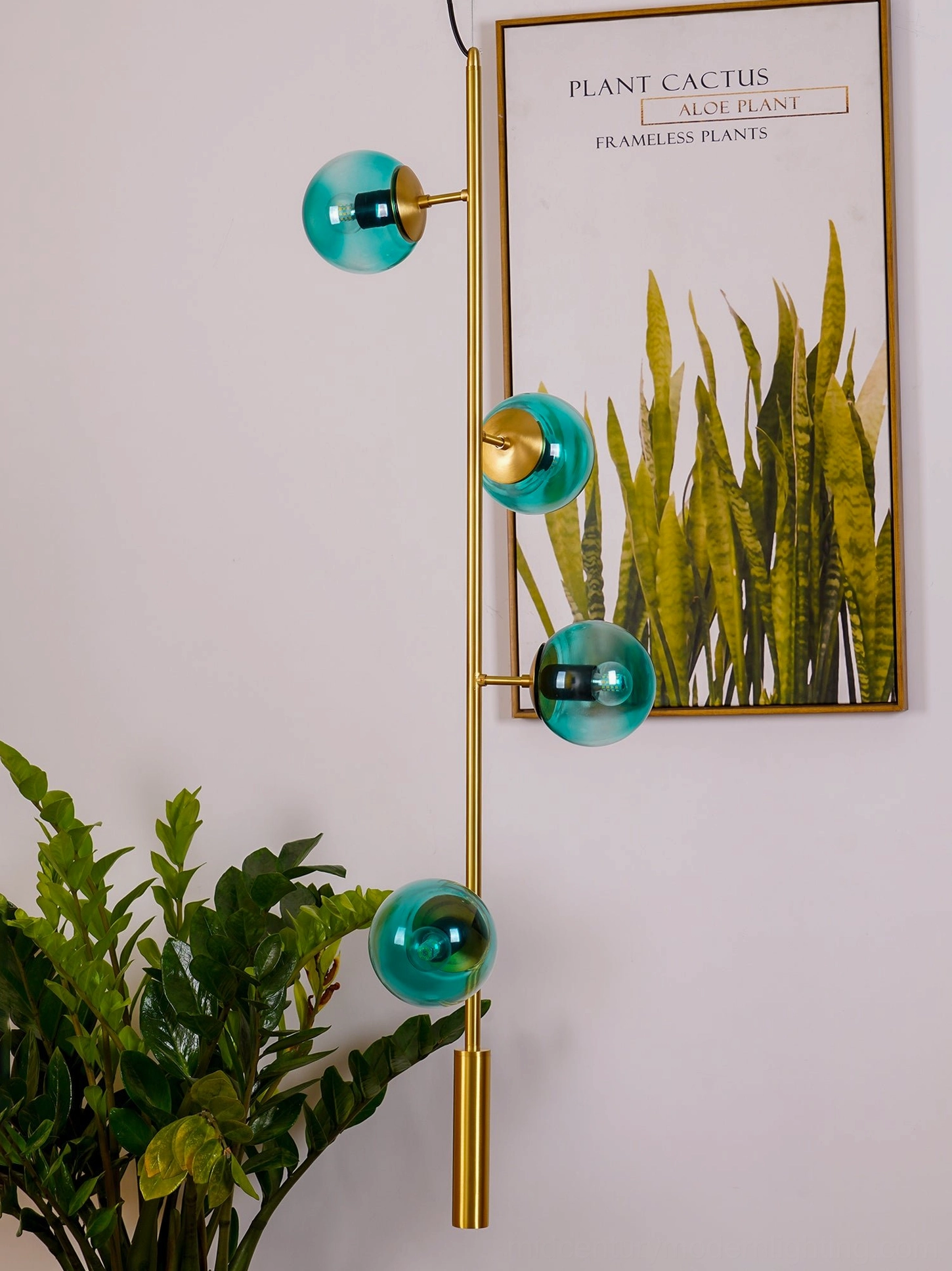 Designer orb pendant light with frosted white glass and polished brass hardware