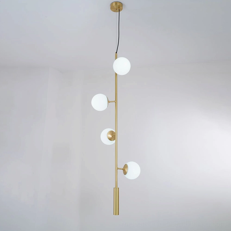 White frosted orb pendant light with warm brass hardware for minimalist spaces