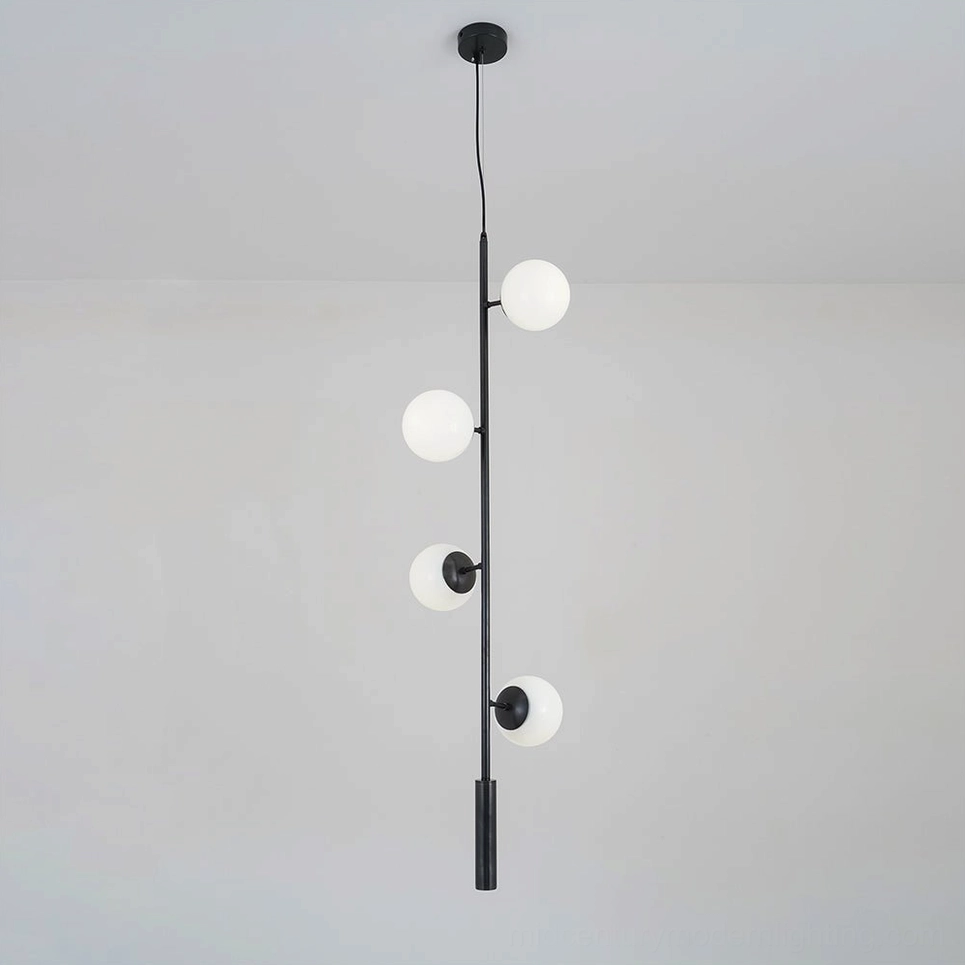 White orb pendant light with frosted glass shade and brass rod, minimalist design