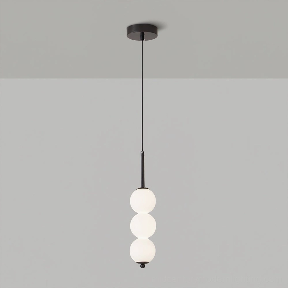 Three-orb Orbet pendant lamp in black showing compact frosted glass design