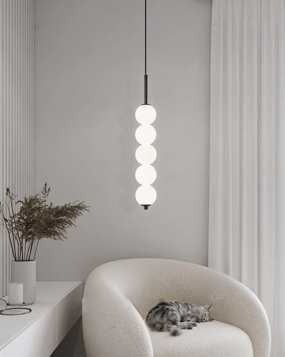Three-orb Orbet pendant lamp in brass finish compact configuration for bedside lighting