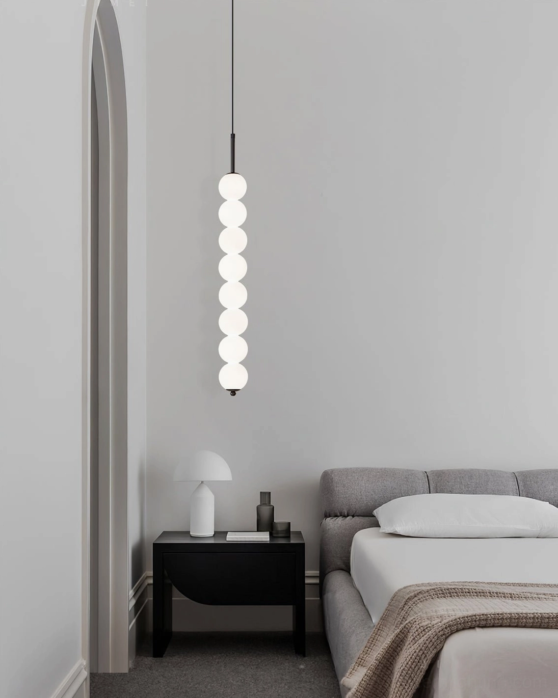 Three-orb Orbet compact pendant lamp installed above entryway in modern home