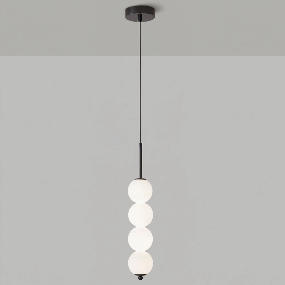 Four-orb Orbet pendant lamp in black hardware standard height configuration