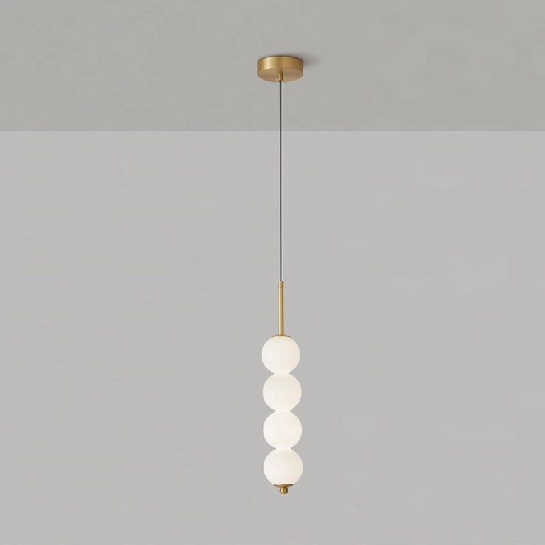 Four-orb Orbet pendant lamp in brass finish mid-height lighting solution